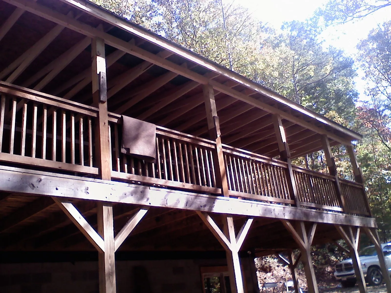 Timber framing under a new elevated porch and deck — Roof Leak Repair in Hood by Roofing Brothers
